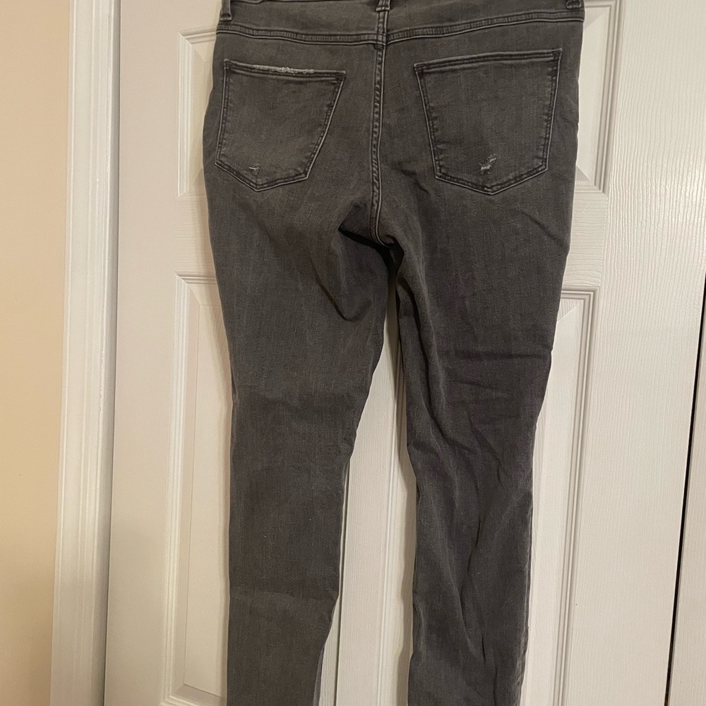 Grey/black acid green watch skinny jeans with rips on the ankle